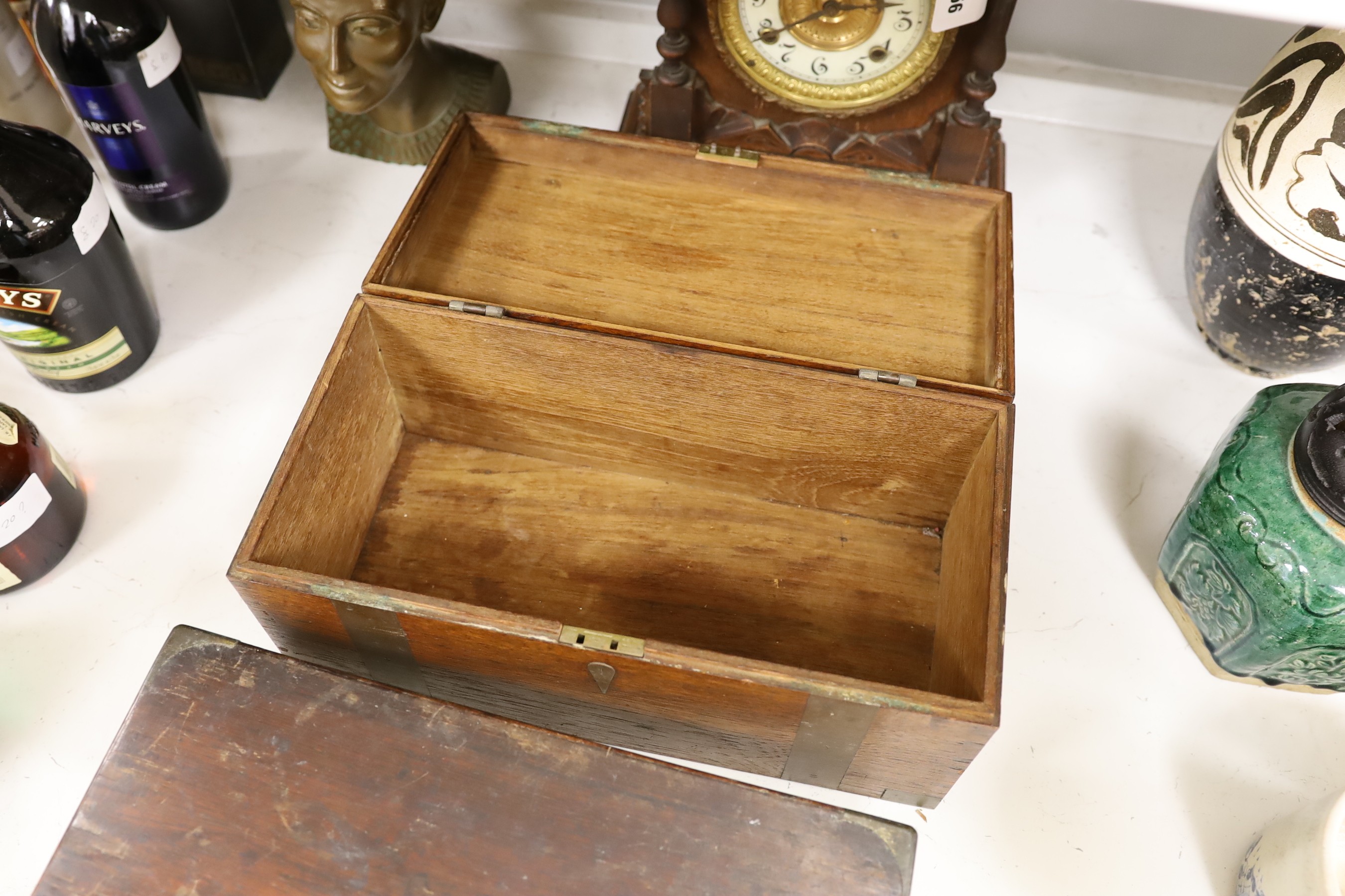 A brassbound box, a writing slope, a mantle clock, 37.5cm tall, and a bust of Nefertiti